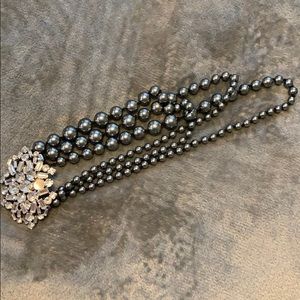 A dark grey necklace